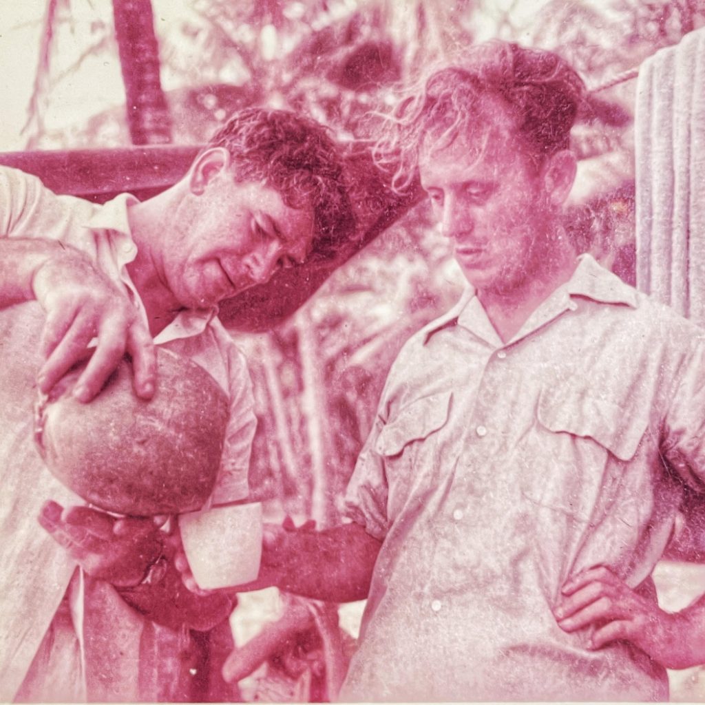 Donald Webster (left) and Tony Halliday (right), co-founders of Design Group Nigeria, partaking of some local hooch, at some point in the mid-1950s. Image: Peter Halliday.
