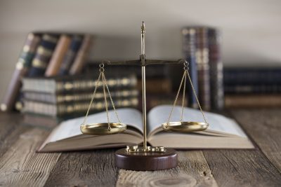 Law book and scales of justice