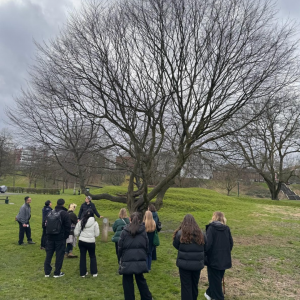 People walking through Peel Park in winter.