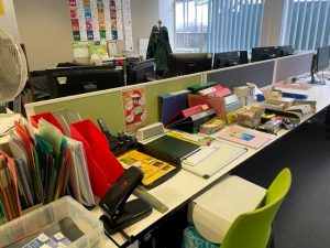 A collection of stationery items on a desk