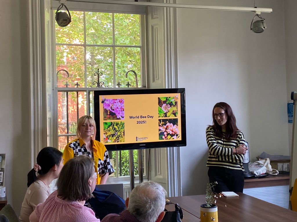 Two members of the Sustainability Team presenting a "World Bee Day 2025" presentation.