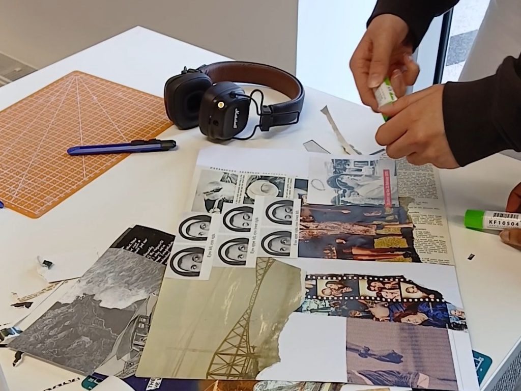 A table with collaging happening on it.