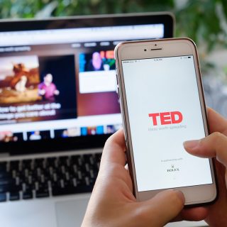 Someone watching a TED Talk on there mobile and desktop device