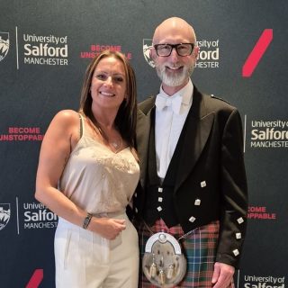 Gail Hadfield Grainger posing for a photo with Vice-Chancellor Nic Beech