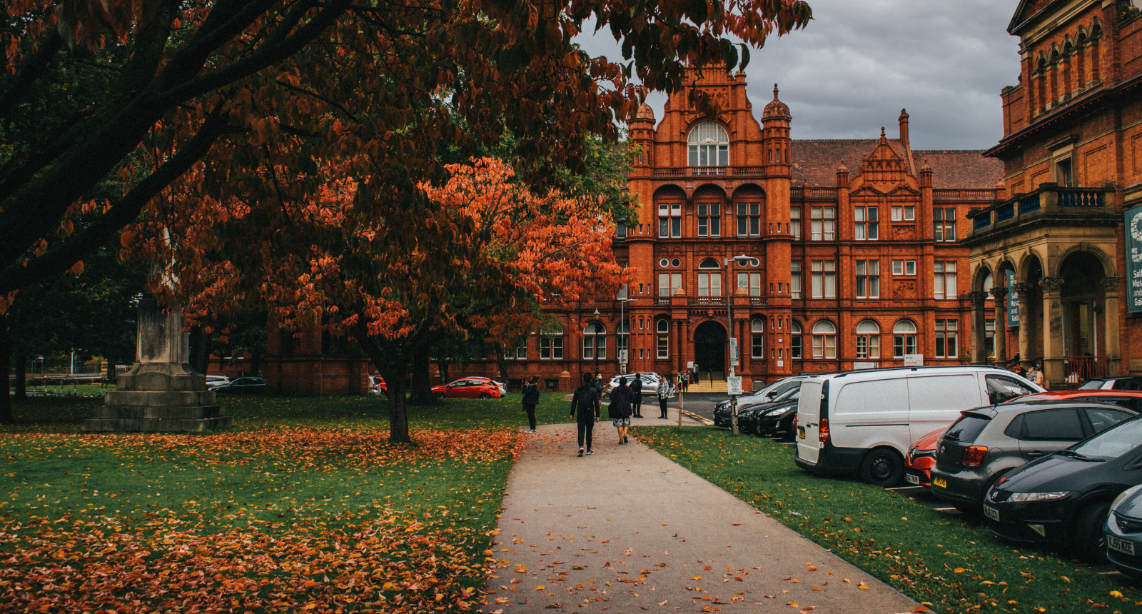 An inspiring photo of the Red brick Peel building and greenery infront