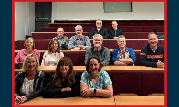Alumni in a lecture theatre after 40 years.
