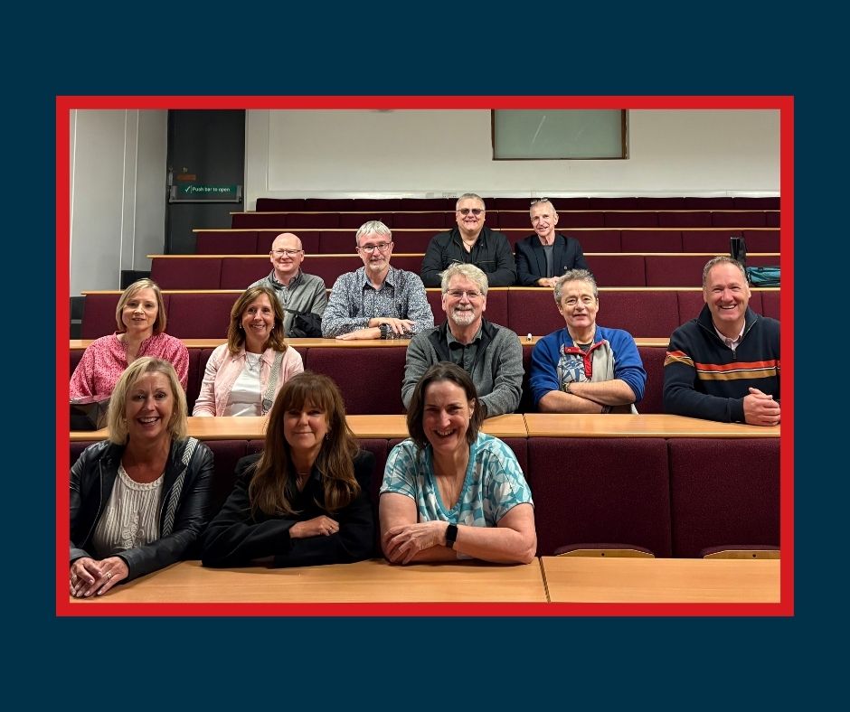 Alumni in a lecture hall after 40 years.