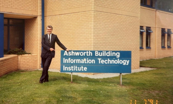 Sir John Ashworth outside the Ashworth building on campus, 1991