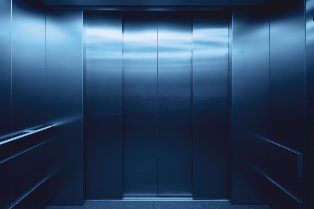 An elevator door, representing access to all floors regardless of physical circumstances