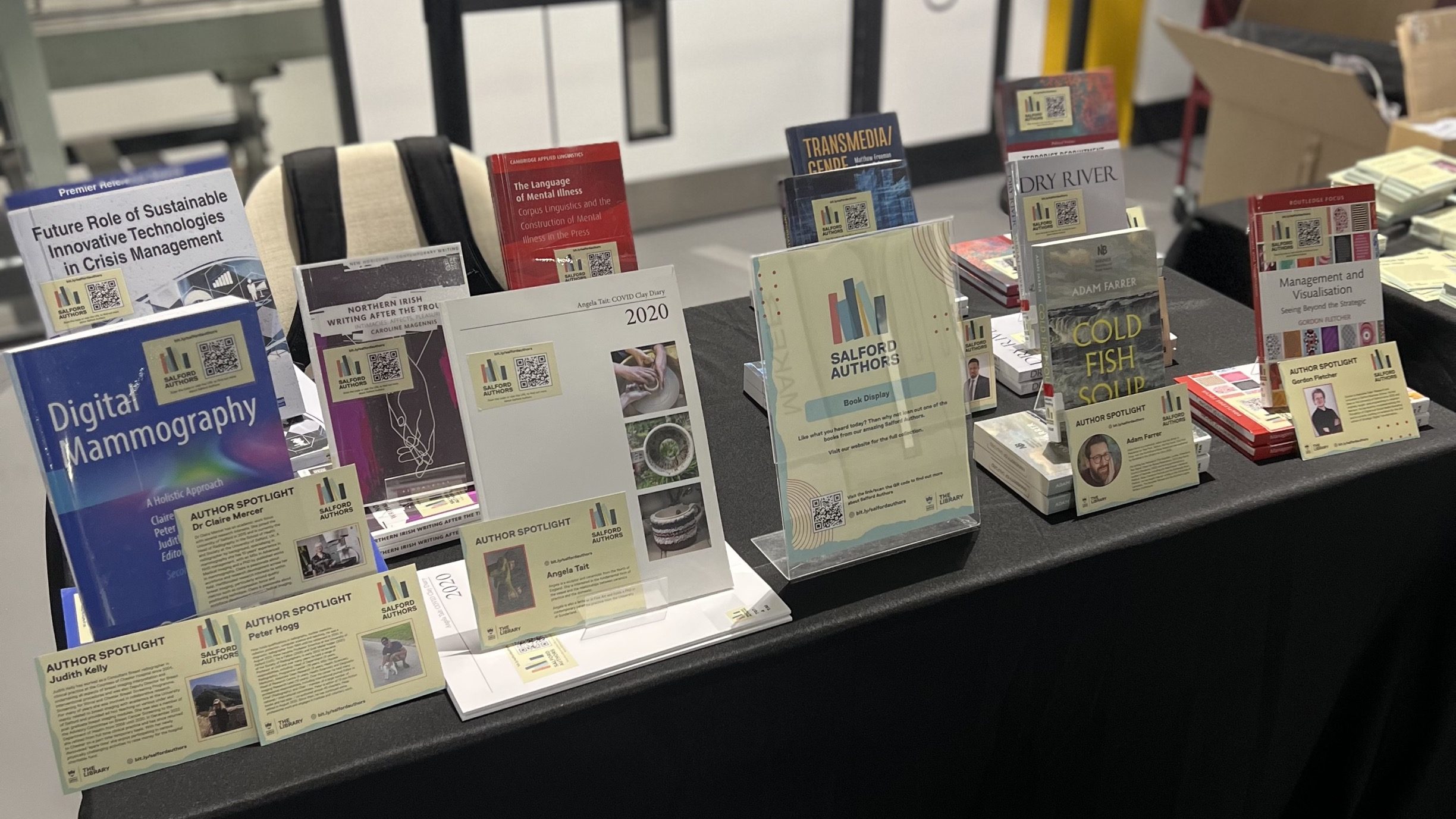 Salford Authors display of books and Author Spotlight cards