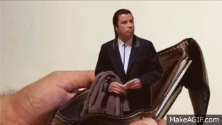 John Travolta standing up out of a wallet