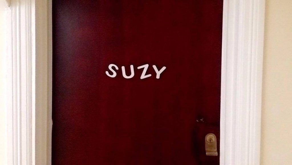 Name 'Suzy' on a red door
