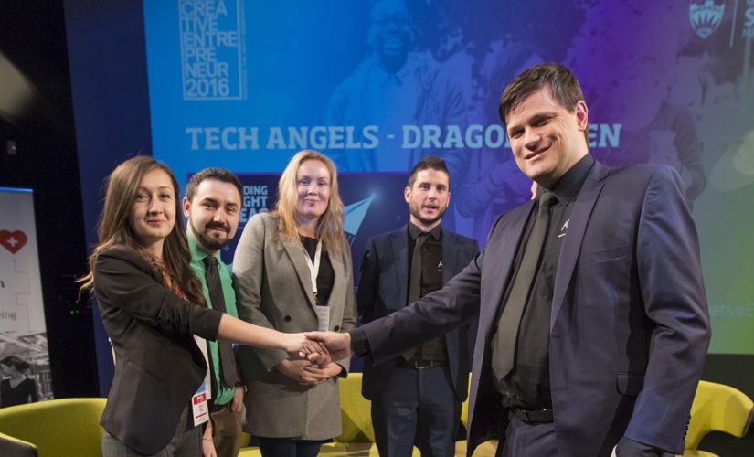 Lavinia shaking hands with the Tech Angels judging panel