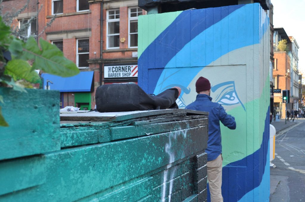 A new piece of street art being painted in Stevenson Square