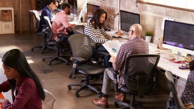 Image: a group of people working in an office