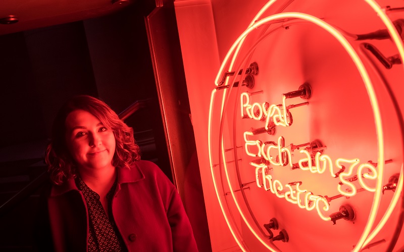 A neon red Royal Exchange Theatre sign