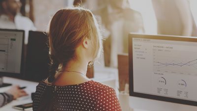 Image of a young woman at a computer
