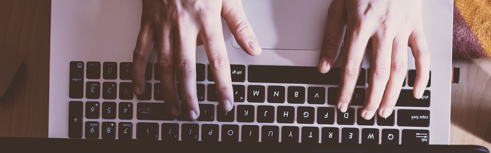 Man typing on laptop