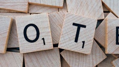 Image: Tiles spelling out the word "Vote"