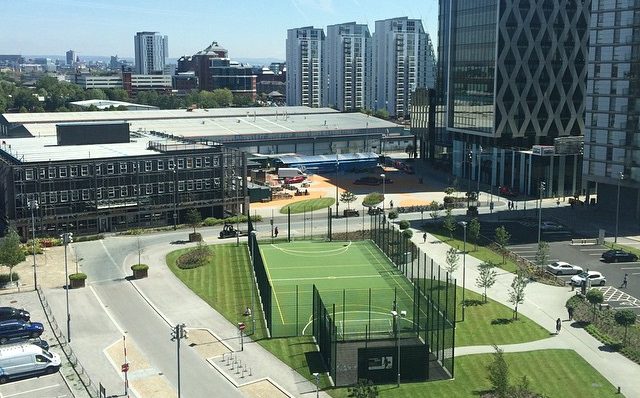 image: aerial view of media city in the summer