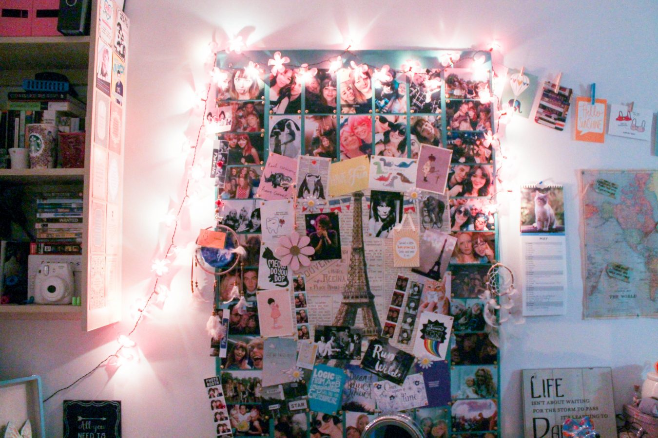 Seren's photo board with pink flower fairy lights around it