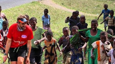 Image: Brendan running accompanied by children