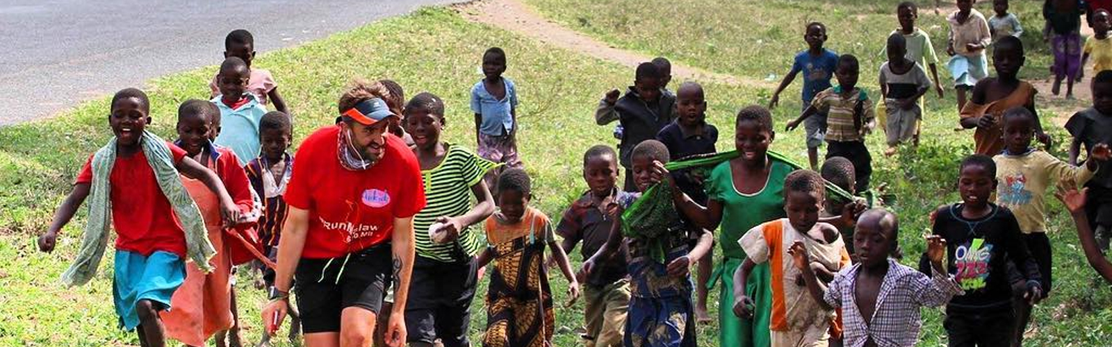 Image: Brendan running accompanied by children