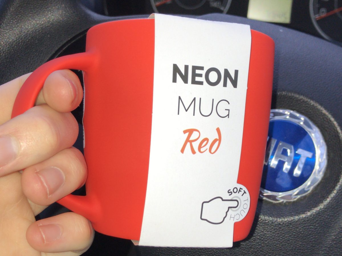 Image of a Neon red mug still in packaging