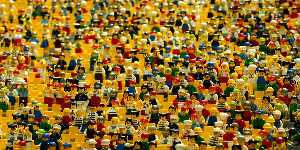 Lots of Lego characters looking like they are a crowd at a festival