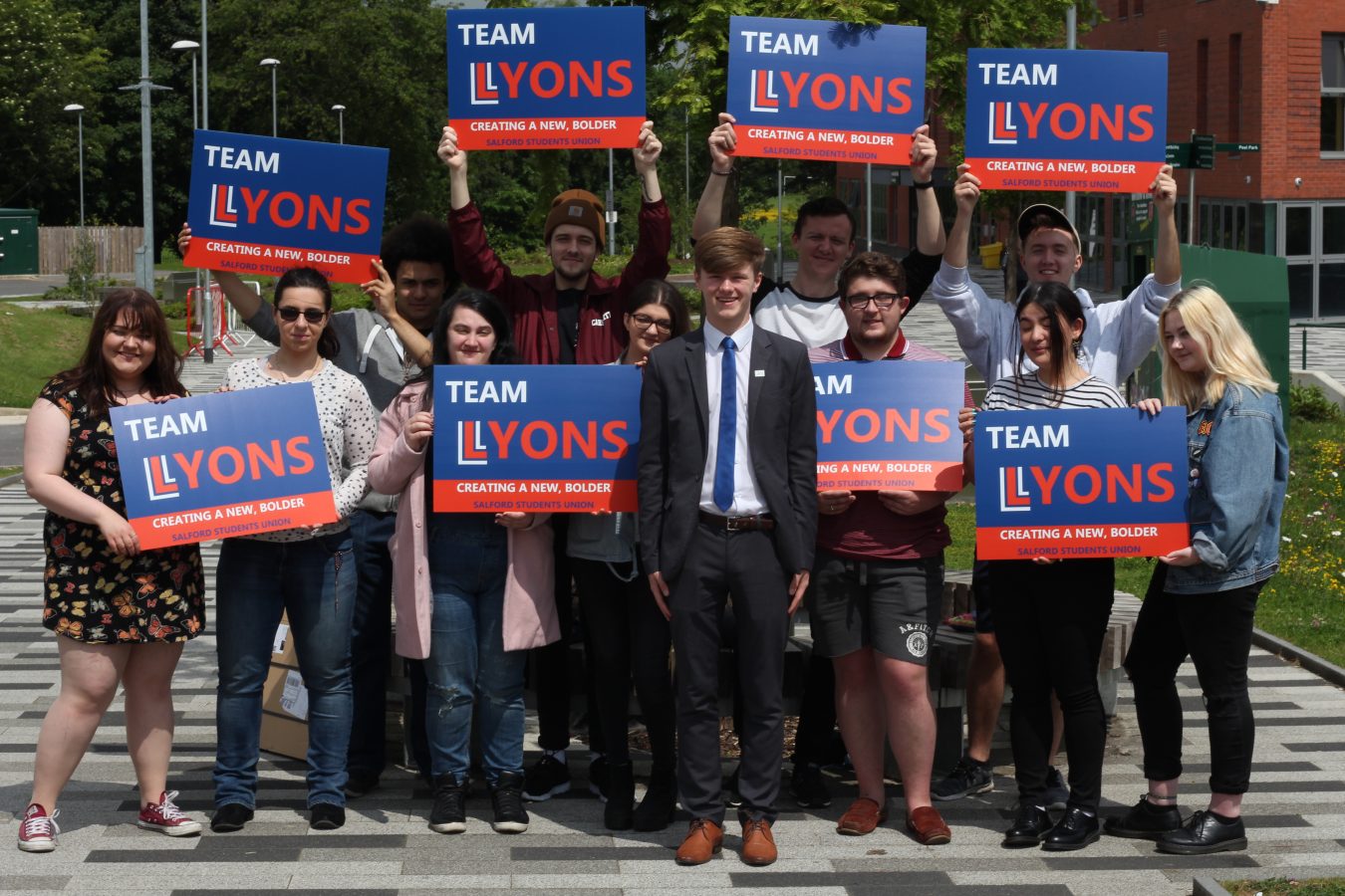 Jon-Connor with other students holding his campaign boards
