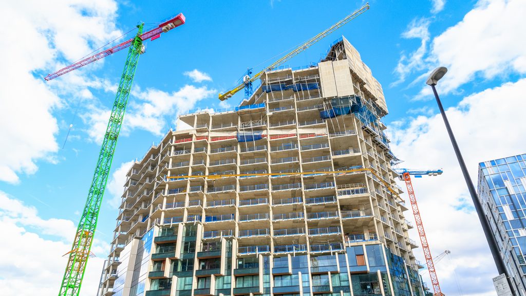 Construction site of a new development in north Greenwich with 3 cranes around it