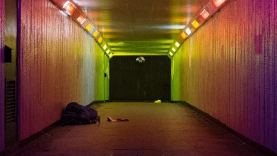 Image: subway with a rough sleeper at the far end