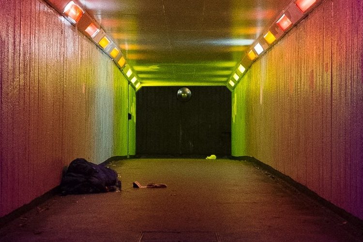 Image: subway with a rough sleeper at the far end