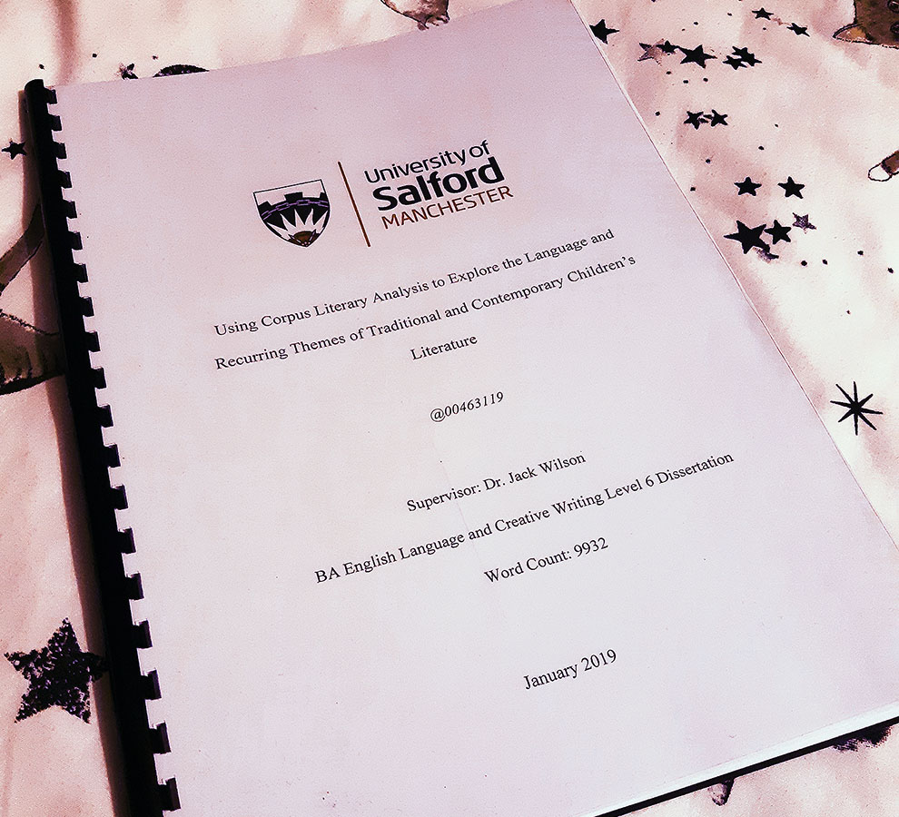 A photo of my personal dissertation. With the title 'Using Corpus Literary Analysis to Explore the Language and Recurring Themes of Traditional and Contemporary Children's Literature' 