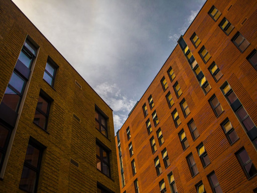 A beautiful warm shot of two of the accommodation buildings in Peel Park Quarter