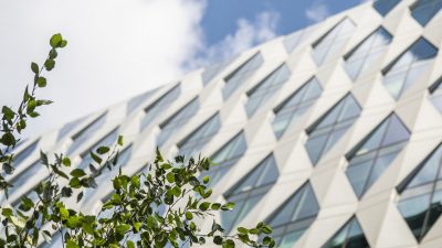 A shot of a building in MediaCityUK, the sky is clear and blue.