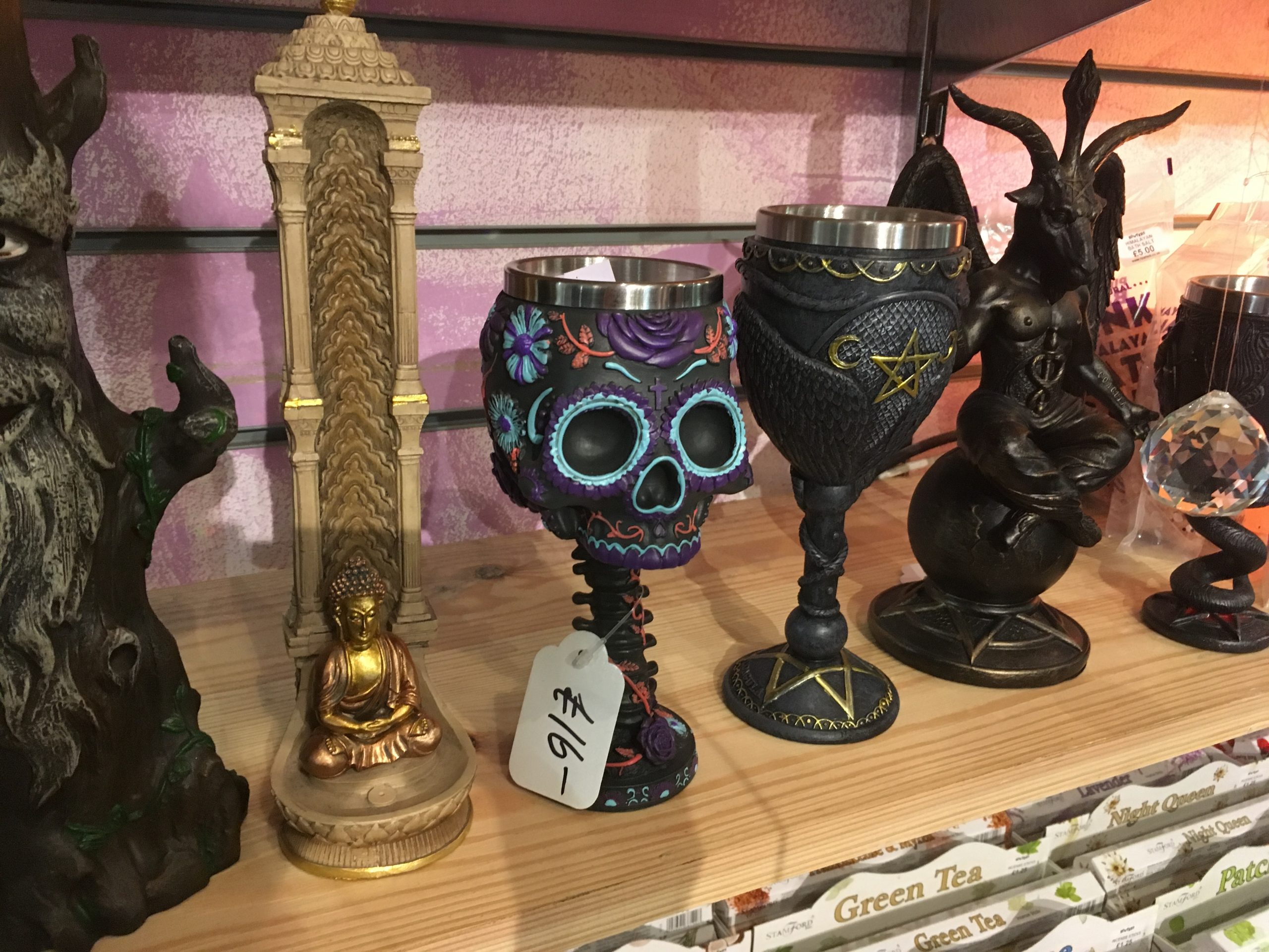 Skull patterned goblet for £16 on a shelf with an assortment of spooky drinks receptacles