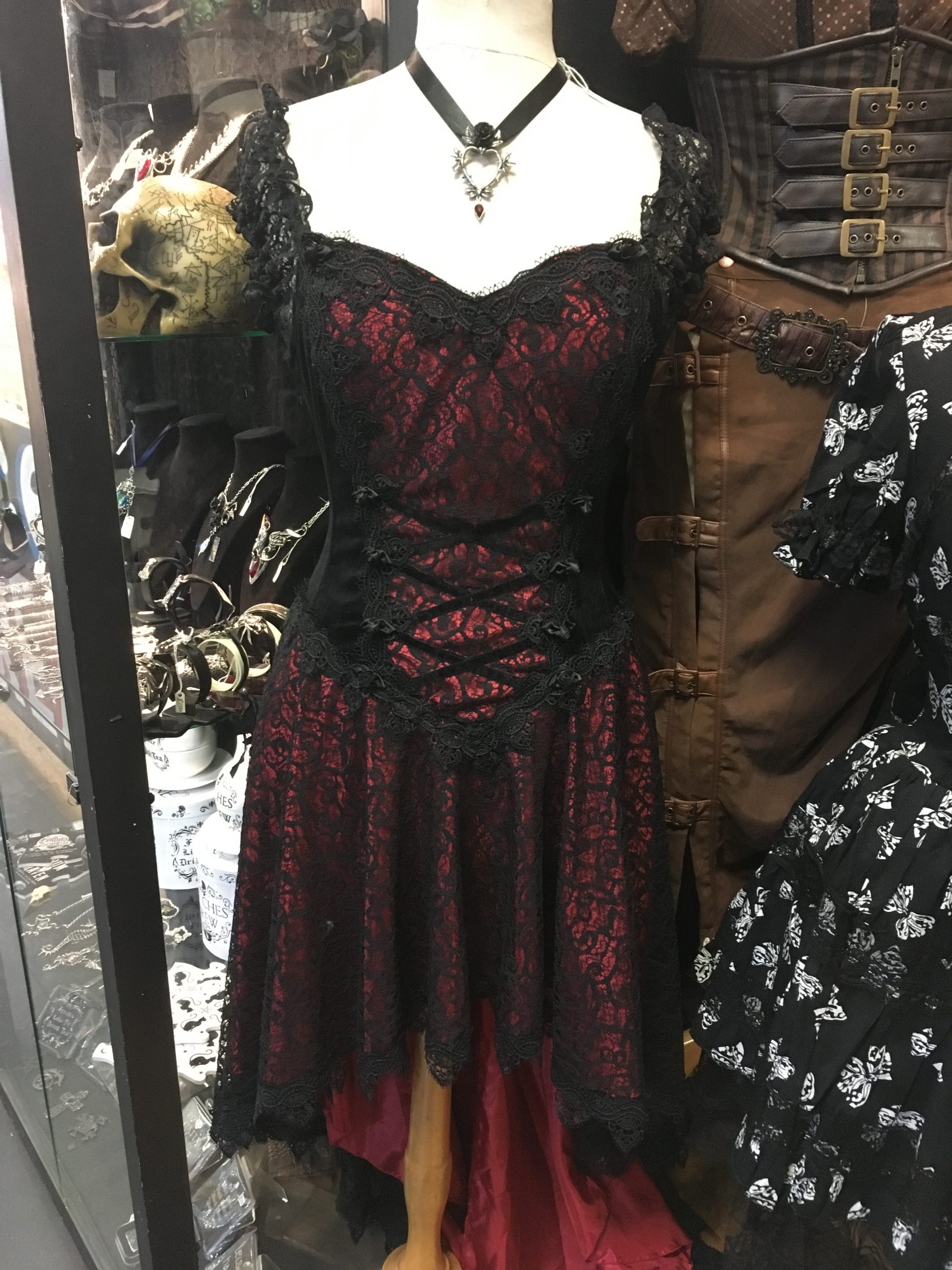 Steampunk dress with red material covered in black webbing