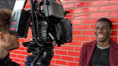 Photo of Ade smiling to the camera