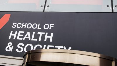 Photo of Health and Society banner infront of mary seacole building