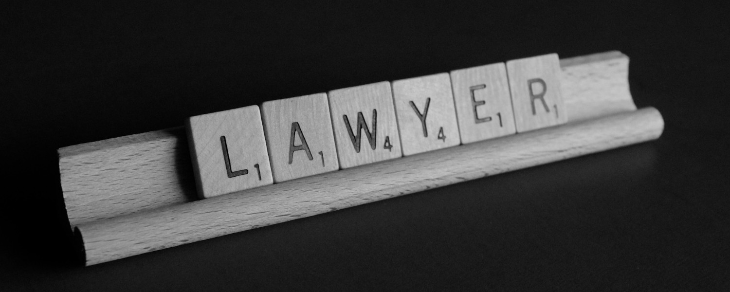 Image of the word "Lawyer" spelt out with scrabble pieces