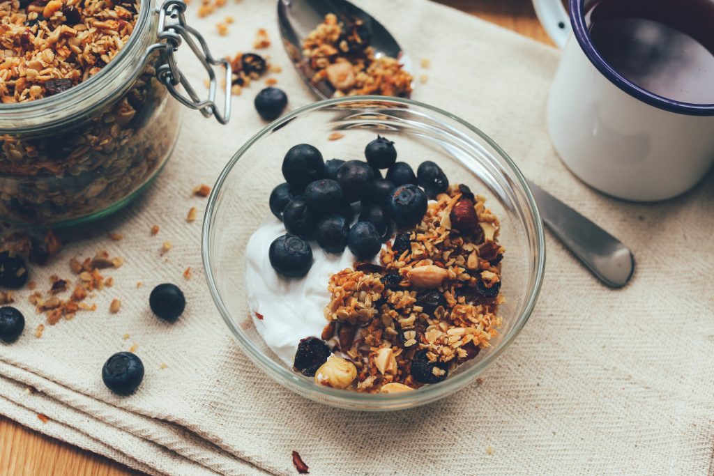 Image of a bowl of granola with blueberries.
