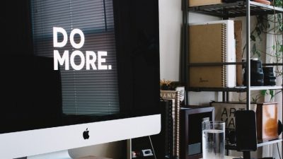 A computer with "Do More" written on the monitor