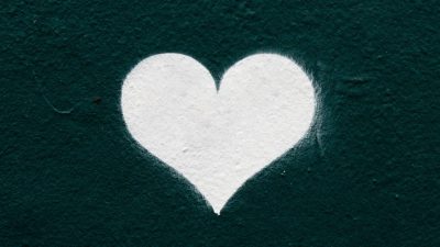 Image of white chalk heart on a dark background