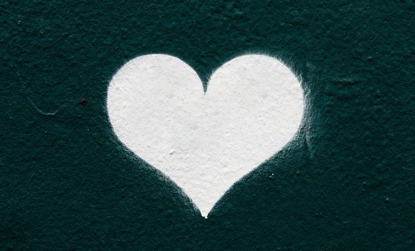 Image of white chalk heart on a dark background