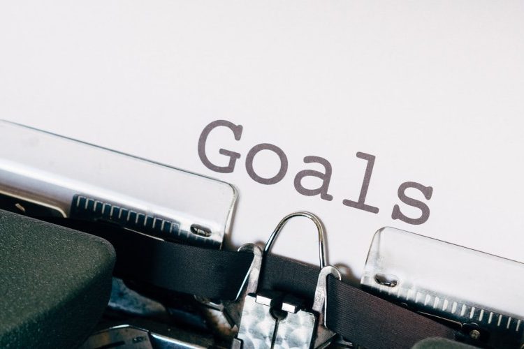 Image of an old fashioned typewriter spelling out the word "goals"