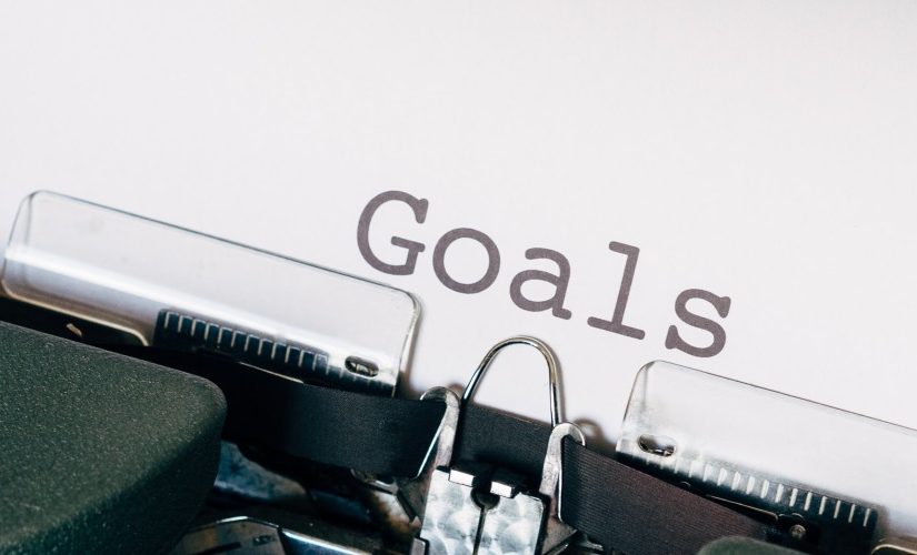 Image of an old fashioned typewriter spelling out the word "goals"