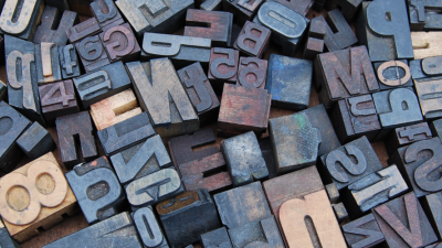 Photo of different letters in wood stamp