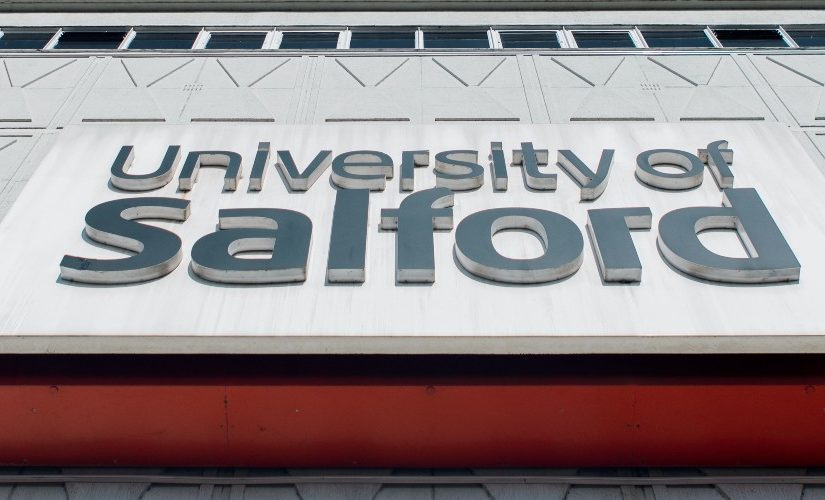Close up photograph of the University of Salford sign on Maxwell Building