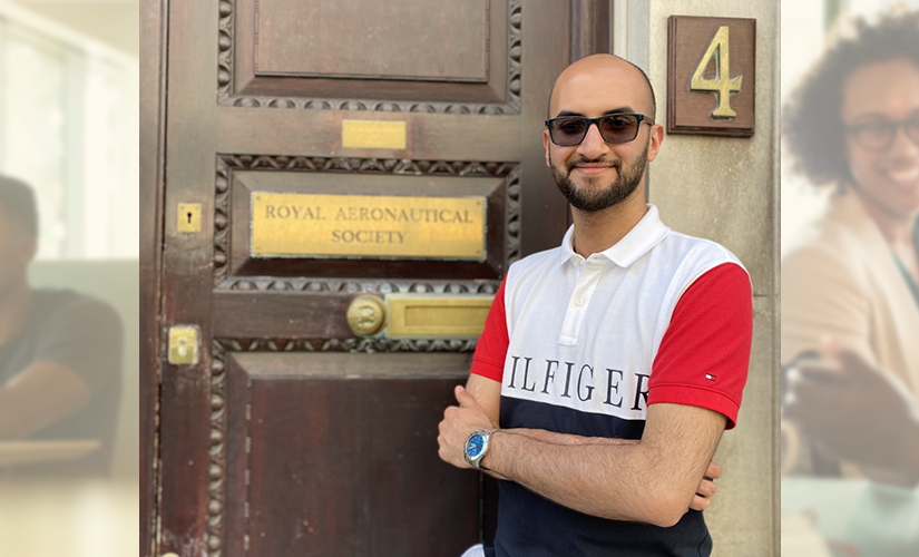 photo of Abdul standing next to the Royal Aeronautical Society door